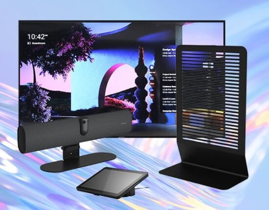 TV screen showing a colorful landscape with a black soundbar on a stand, a tablet on a small stand, and a tall black vertical space heater with a slatted grille